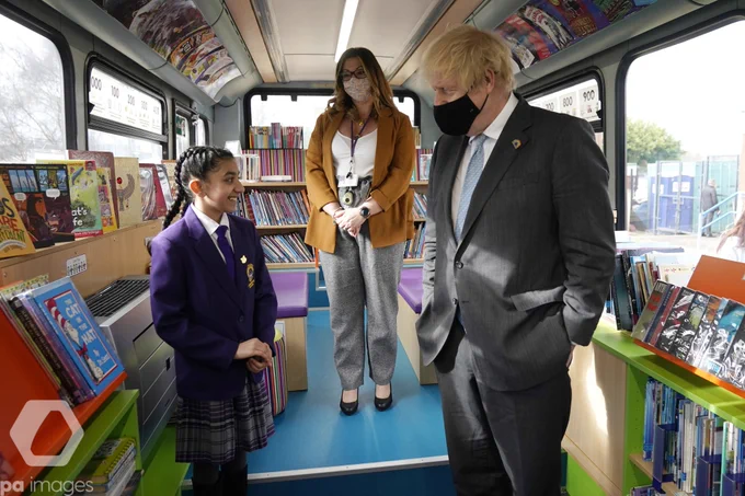 Prime Minister Boris Johnson speaks with head girl Hirah Hussain in the Book Bus library during a visit to St Mary's CE Primary School in Stoke-on-Trent, Staffordshire, to see how they are preparing for students to return. 