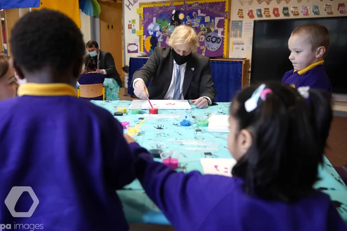 Prime Minister Boris Johnson joins a reception class painting lesson during a visit to St Mary's CE Primary School in Stoke-on-Trent, Staffordshire, to see how they are preparing for students to return. 