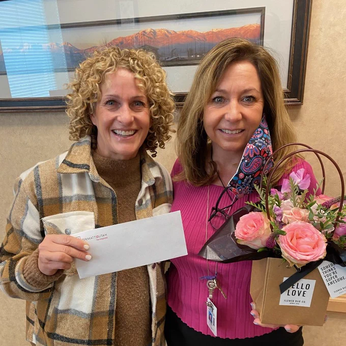 WHS WPN President presents the Teacher of the Month award to Kim Foy.