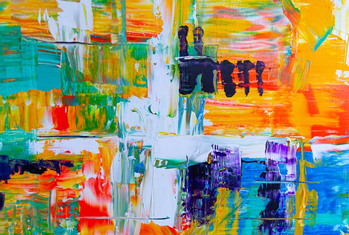 woman in black dress standing on multi colored abstract painting