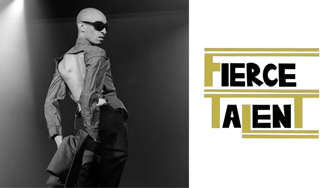 The image is of a man his body is facing away from the camera, his arms thrust behind him and his head is looking to his right. He is wearing sunglasses and a shirt with the back cut out. 

To the right of them is a gold and black logo reading "Fierce Talent"