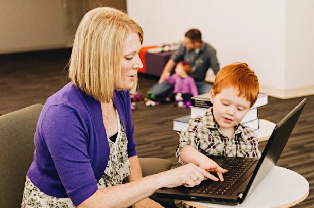 Woman and child using a laptop