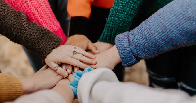 hands in a huddle