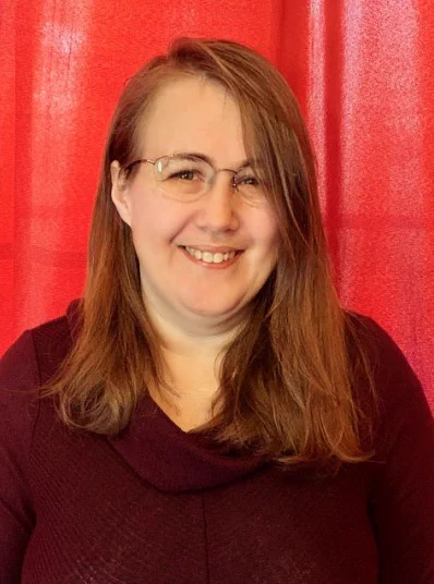 A photo of media coordinator, Angie Mitchell.
