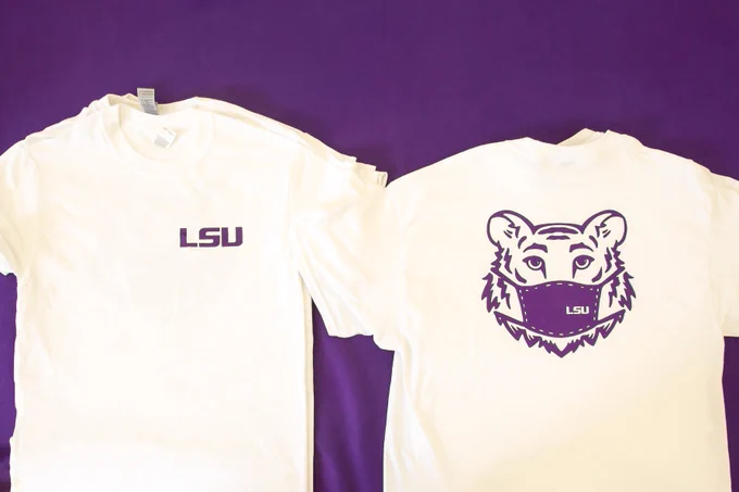 t-shirt with the LSU logo on the front and the animated tiger head wearing an LSU-branded mask is on the back