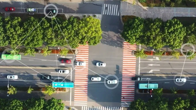 Overhead view of intersection with vehicle traffic with design layered to highlight traffic pattern movement.
