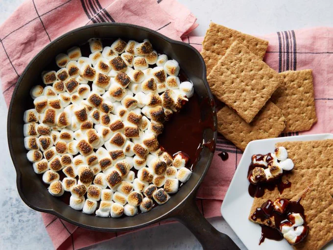 S'mores Dip in frying pan, graham crackers awaiting to be "dipped".