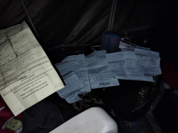 Tickets for camping. About 7 of them in the background.