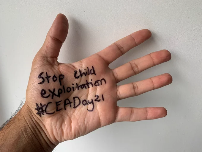 Photo of hand on which is written: Stop child exploitation #CEADay21