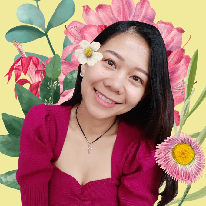 close-up image of woman surrounded by flowers