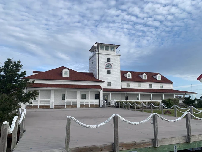 NCCAT in Ocracoke, NC. A white building with a red tin roof.