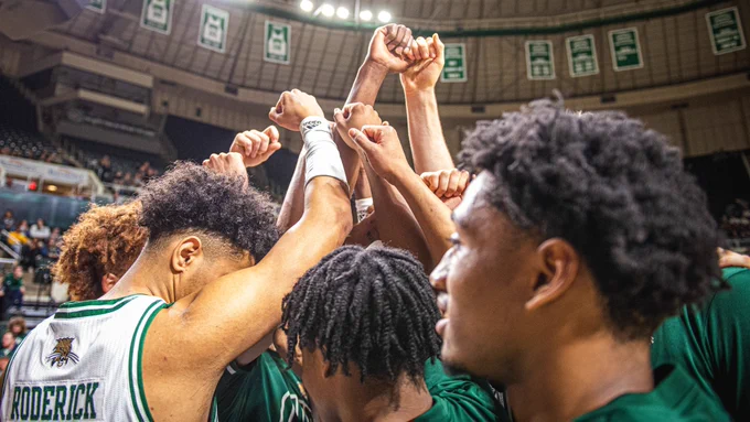 Ohio Men's Basketball team huddles together before a game at the Convocation Center during the 2019-2020 season.