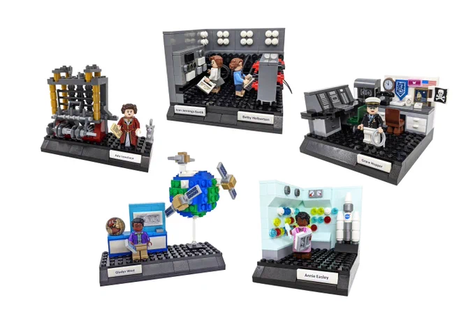 Photo of five LEGO vignettes featuring Ada Lovelace and the Analytical Engine, Jean Bartik and Betty Holberton and the ENIAC, Grace Hopper with the UNIVAC and her desk, Gladys West and a globe with satellites (GPS), and Annie Easley in a NASA control room