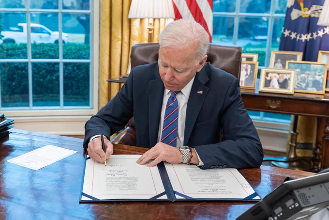President Biden signs the SAVE LIVES Act into law in the Oval Office