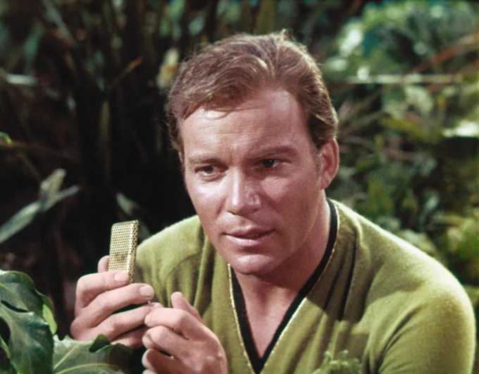 Captain Kirk using communicator
