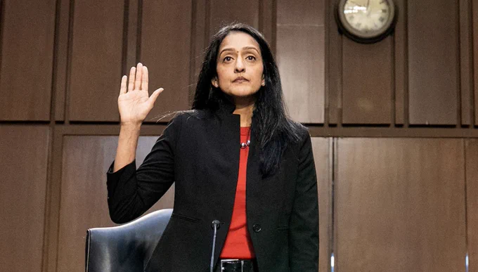 A photo of Vanita Gupta raising her hand as she gets sworn in to her Senate Judiciary Committee confirmation hearing.