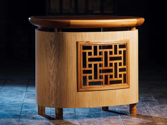 Wooden cabinet with carving at front