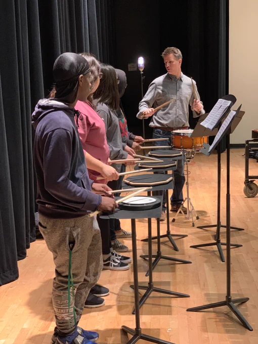 Principal percussionist MatthewMcClung works with students on All-Region audition music in 2019