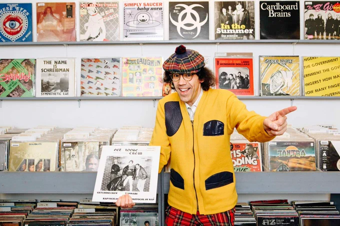 Nardwuar holding the first rap record to come out of Canada ! in 1988 ! It's by The Get Loose Crew !
