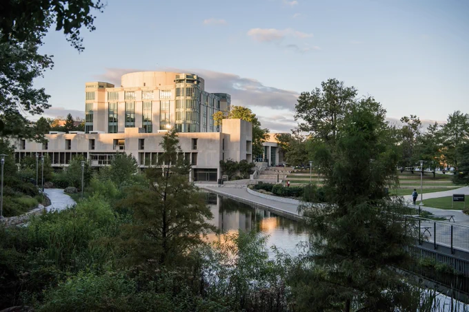 UMBC library exterior shot with lake and grass view