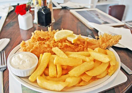 A plate of fish and chips at Magpie Café, Whitby, Yorkshire, England. Credit: VisitBritain