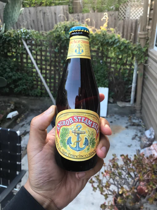 my left hand holds a bottle of Anchor Steam Beer into the setting San Francisco sun. it carries the old and Good label, and is the last bottle with said label that i have. i’m about to drink it, but not without a fair dose of sadness for the soul-sucking boringness of their ill advised redesign 