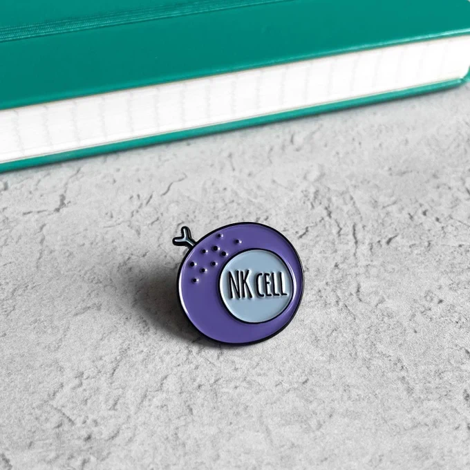 Photo of an emailed pin shaped like an Natural Killer immune cells