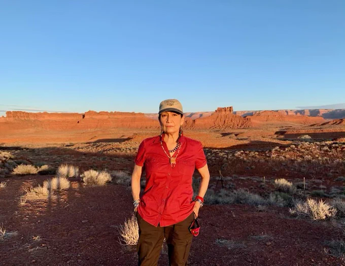 Secretary Haaland stands looking at the camera at Valley of the Gods 