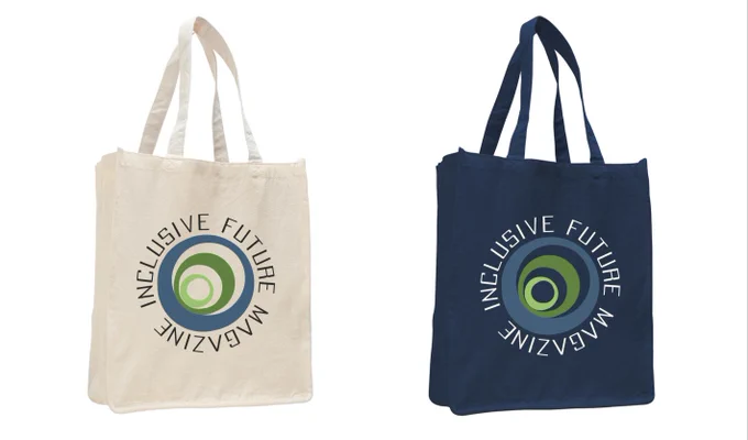 Two tote bags, one cream and one navy blue, side by side. They are a digital mockup and both have the Inclusive Future Magazine logo on them. 