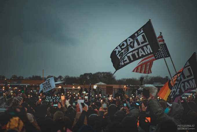 The 4th day of protests outside of the Brooklyn Center Police Department, people in the crowd turn their phone's light on, and hold it up; a sign of solidarity and a moment of peace remembering Daunte Wright (Tuesday, April 13th, 2021)