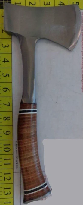 Axe with a wooden handle found in a passenger's carry-on bag at El Paso International Airport by TSA officers during security checkpoint screening.