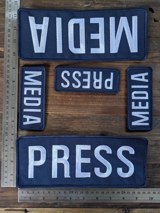 The identification worn on the chest, back, and head of an independent photojournalist covering the front lines of the Black Lives Matter and Daunte Wright protests in Brooklyn Center, Minnesota. The chest and back patches measure approximately 10 inches wide by 4 inches tall, the head patches measure approximately 5 inches wide by 2 inches tall.