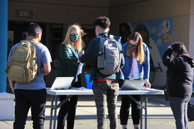 Greeting students at Evergreen High School