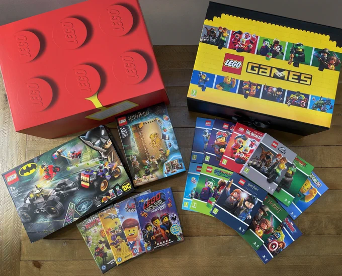 Red & Yellow box representing a LEGO brick alongside a spread of the LEGO bundle prizes noted in the tweet surround the box.
