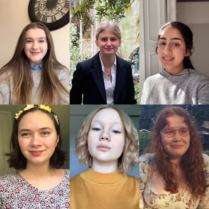 Six young women smile at the camera.
