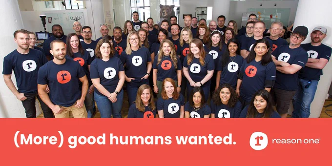 The Reason One team gathered together, wearing "R" logo t-shirts. "More good humans wanted." 