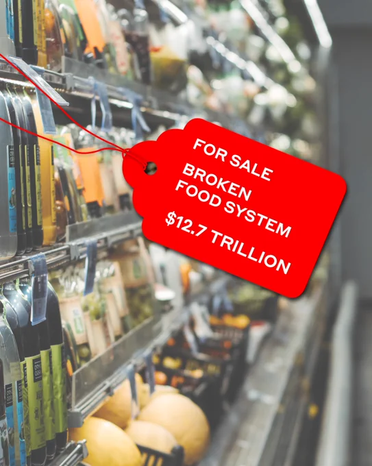 A photo of a supermarket shelf with a red for sale tag saying: FOR SALE
BROKEN FOOD SYSTEM
$12.7 TRILLION