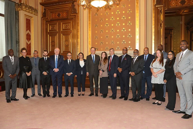 The Foreign Secretary David Cameron photographed with the leaders and representatives of the Overseas Territories in a grand ballroom.