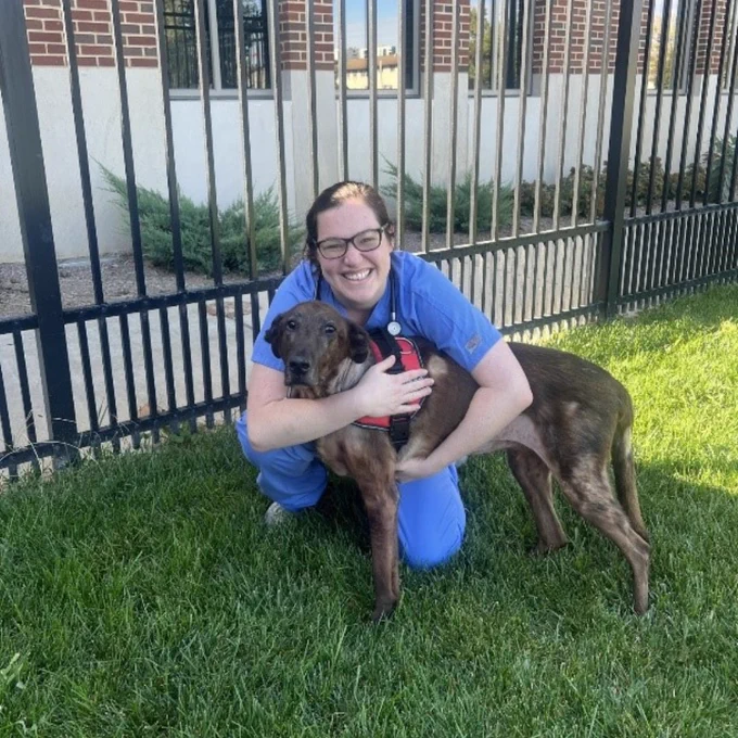 Chip getting hugs from one of his veterinary medical team outside of the Purdue University Veterinary Hospital.