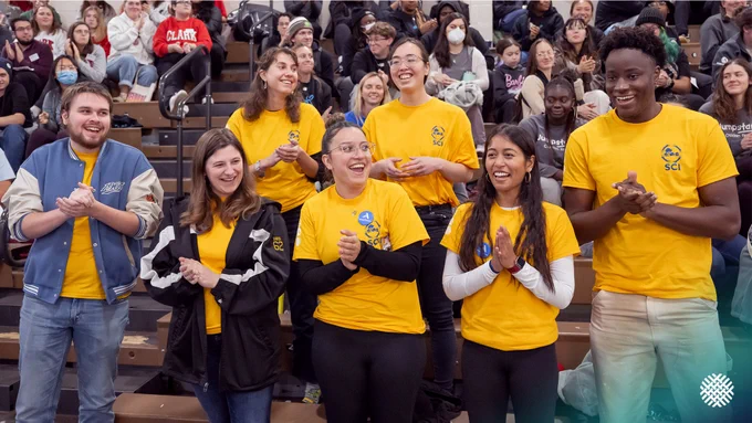 SCI AmeriCorps members clapping at Opening Day.