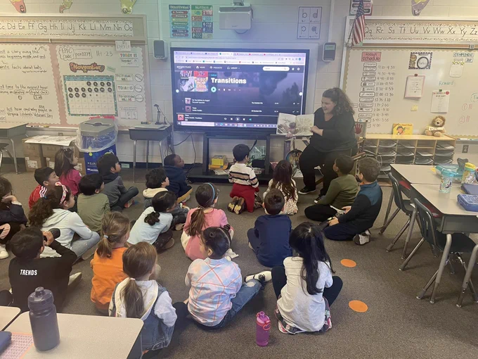 Teacher reading to a class