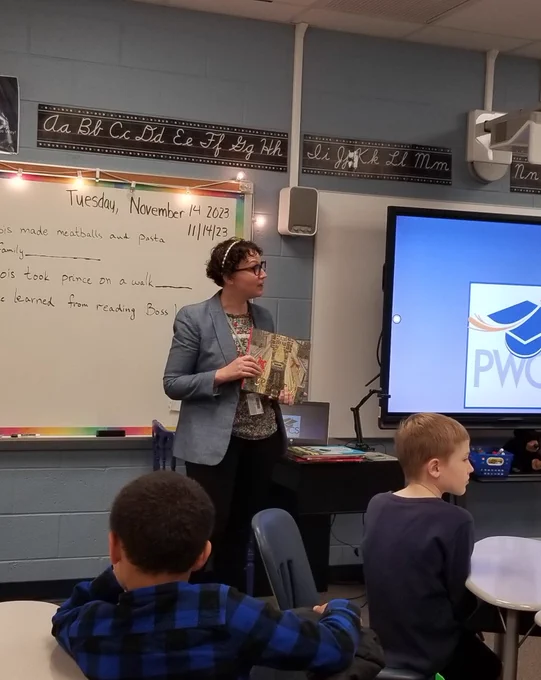 Teacher reading to a class