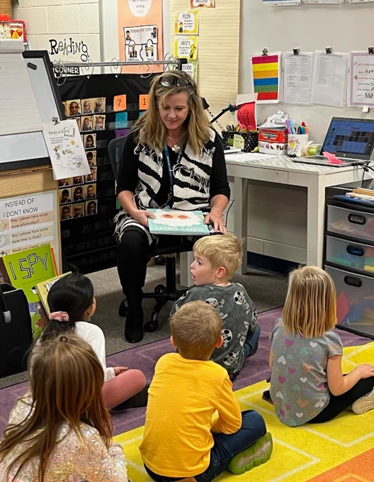 Teacher reading to a class