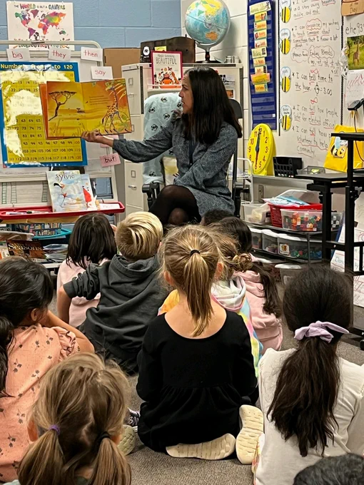 Teacher reading to a class