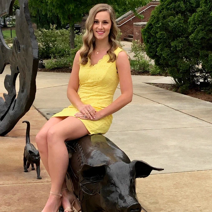 Purdue Alumni, Dr. Brittney Scales at the Continuum Sculpture at Purdue University College of Veterinary Medicine.