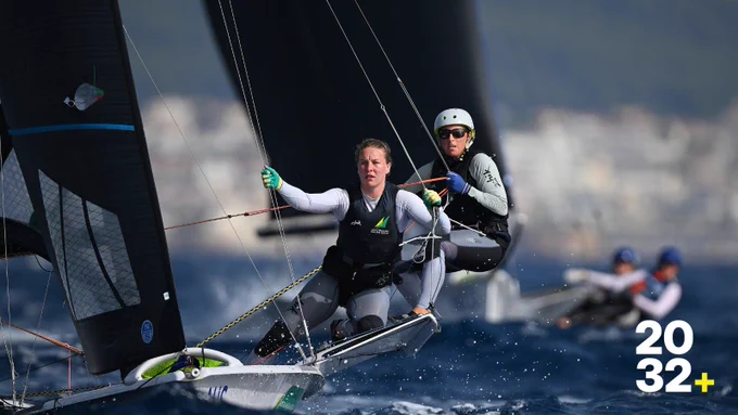 Two athletes sailing.