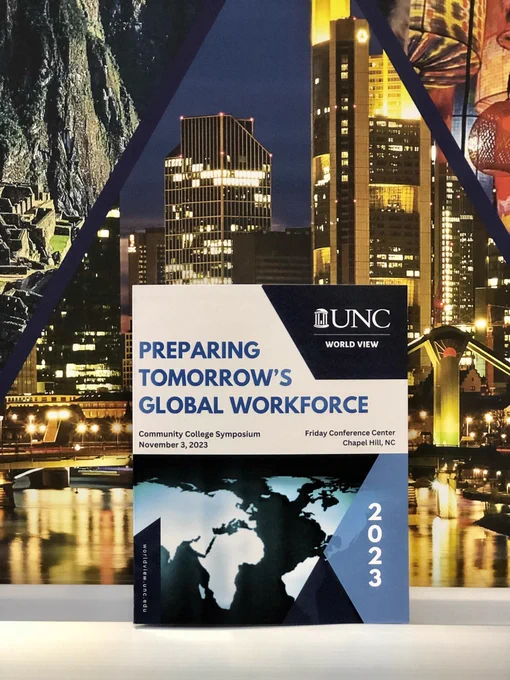 The program for the UNC World View Community College Symposium against the World View banner.
