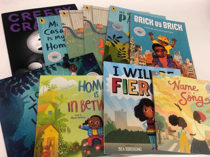 image of picture books neatly spread out on a table. 