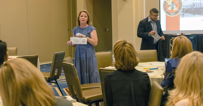 Katelyn Mansdorf, the wife of a U.S. Marine, participates in an icebreaker as part of the Marine Corps Support Facility New Orleans, Spouse Orientation 2023, at the Higgins Hotel, New Orleans, Oct. 20, 2023. The spouses attended briefs given throughout the weekend focusing on the facility, upcoming events, benefits, the surrounding area, and how they can become involved and help with family readiness. This was the first iteration of this orientation and more will be scheduled throughout the following years. (U.S. Marine Corps photo by Lance Cpl. Sarah Pysher)