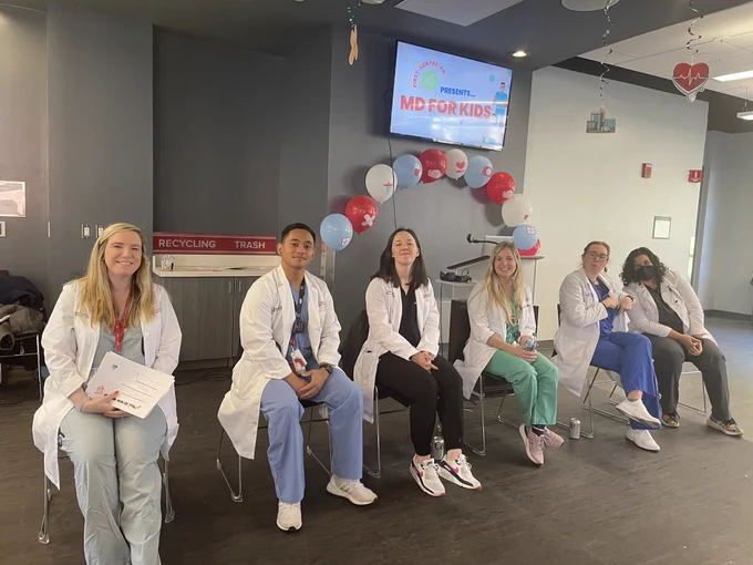 Faculty Tasha Posid and Resident Allen Siapno sit on a panel with other doctors from OSU and NCH.